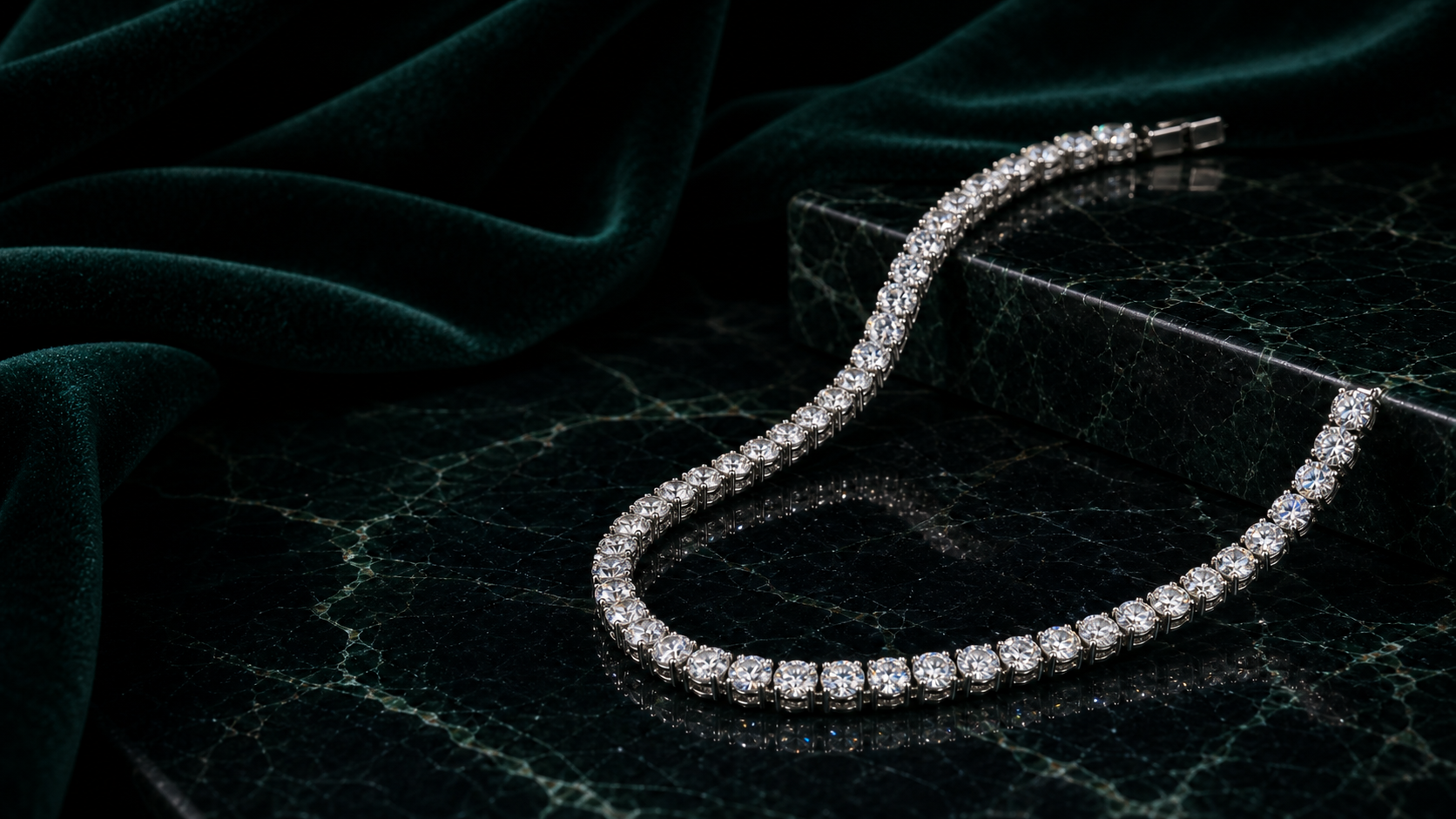 Round brilliant diamond tennis necklace on emerald marble and velvet